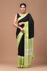Black with green mulmul cotton saree.