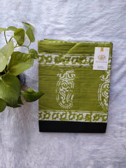 Black with green mulmul cotton saree.