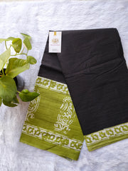 Black with green mulmul cotton saree.
